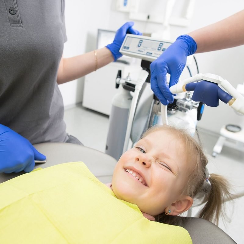 Child smiling in the dental chair
