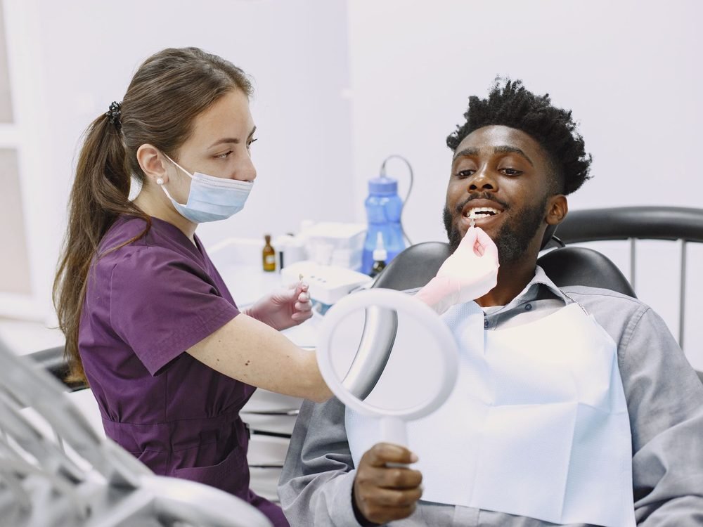 Patient checking his smile after treatment